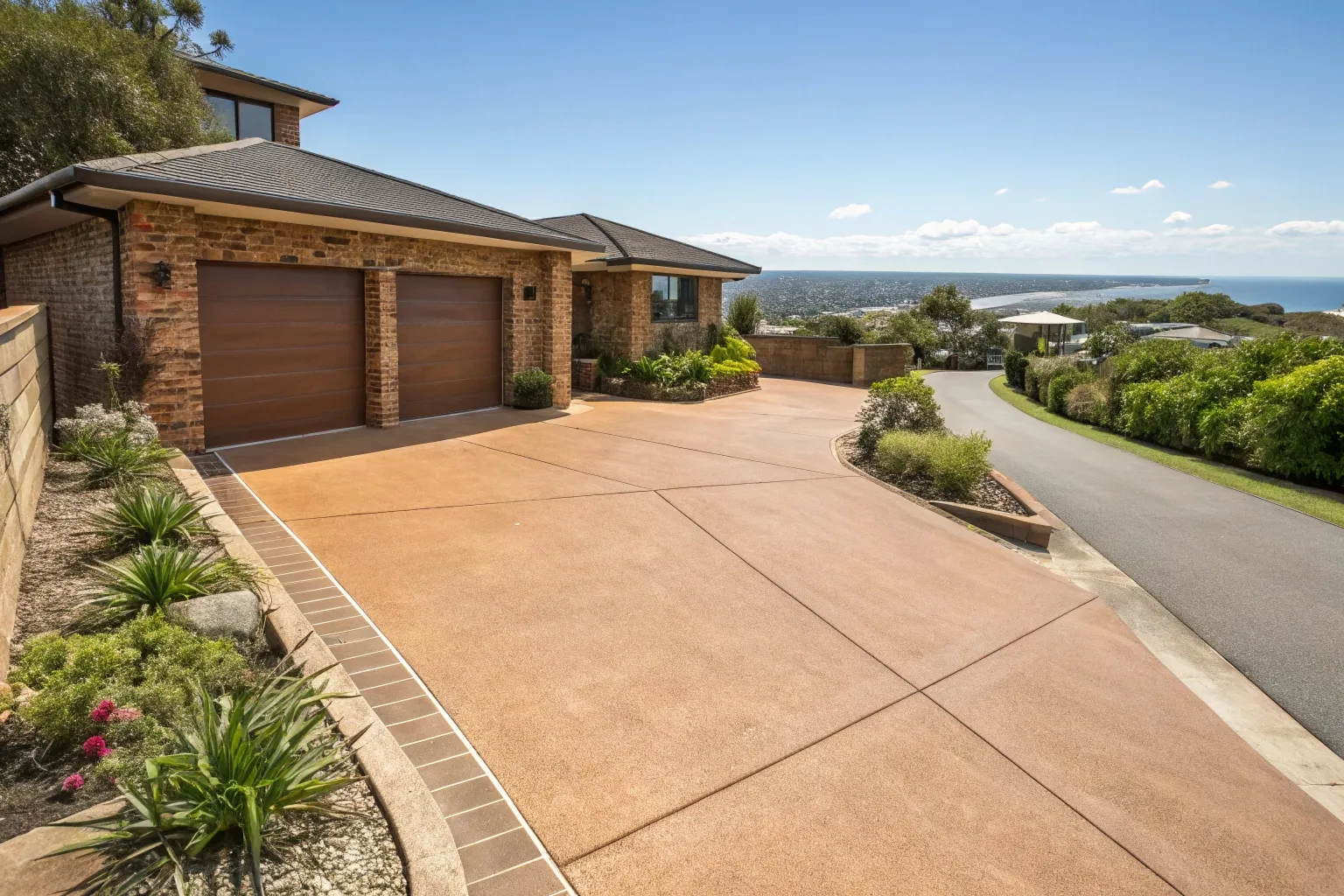 Wide coloured concrete surface in a warm sandstone finish at a coastal Tweed Heads home